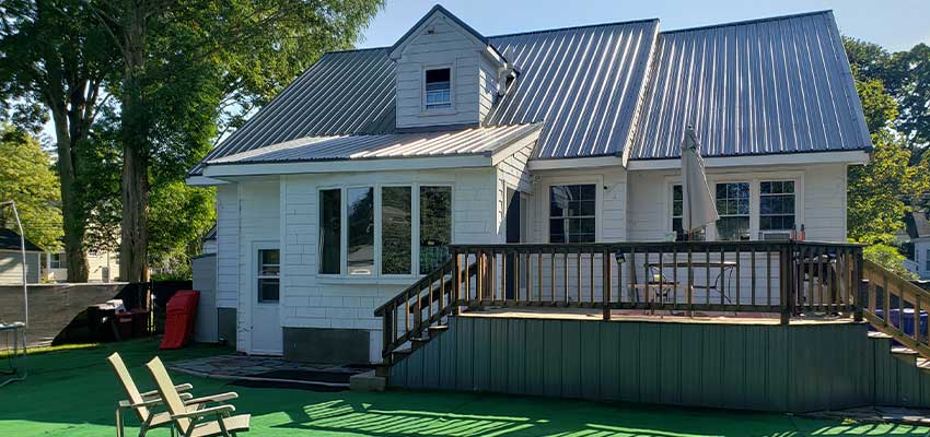 combination-metal-roof-and-shingle-roof-on-home Hingham massachusetts